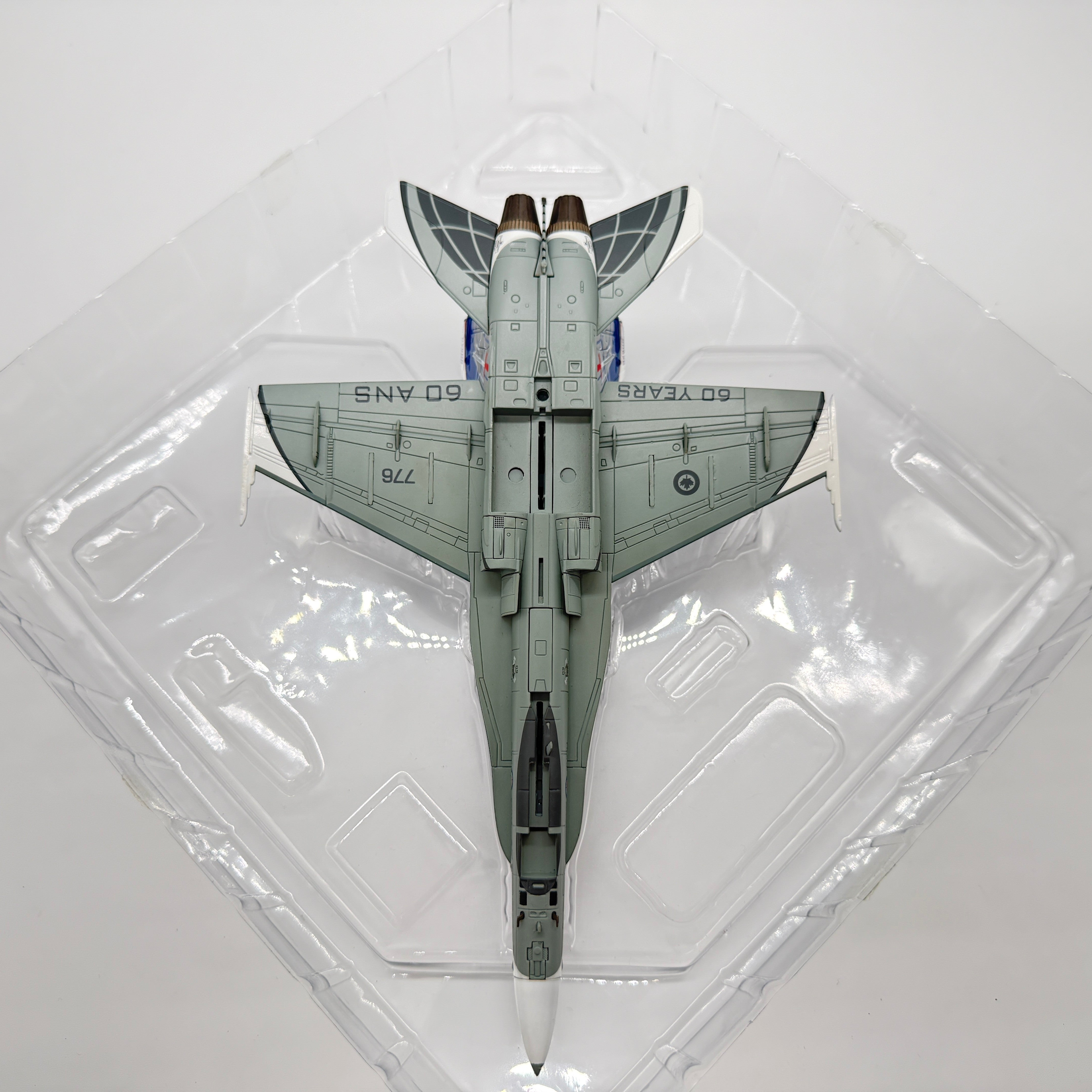 The Collectables Vault Hobby Master 1:72 CF-18 Hornet diecast model, underside view showing NORAD 60th anniversary livery.