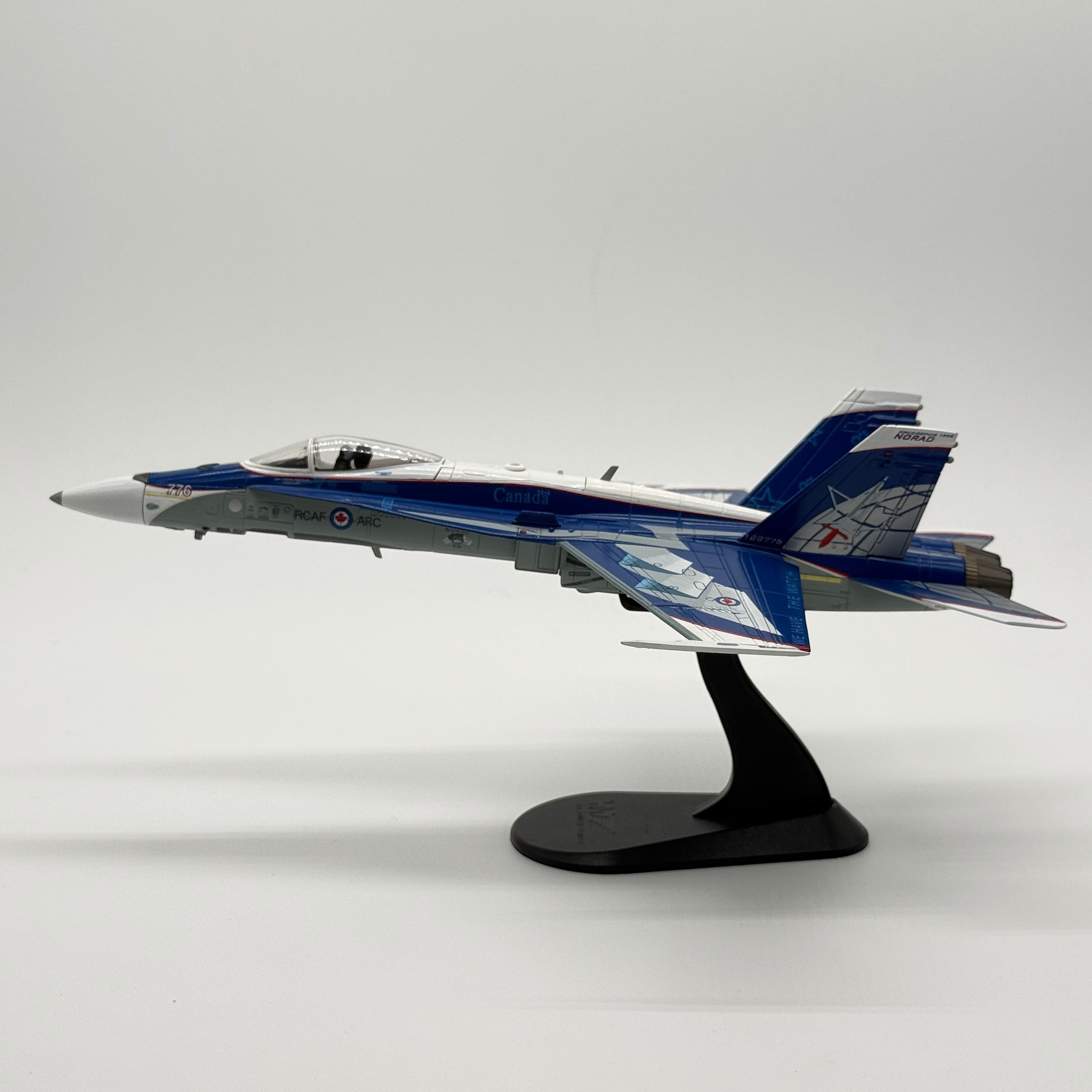 The Collectables Vault Hobby Master 1:72 CF-18 Hornet diecast model in blue NORAD 60th anniversary livery on a stand