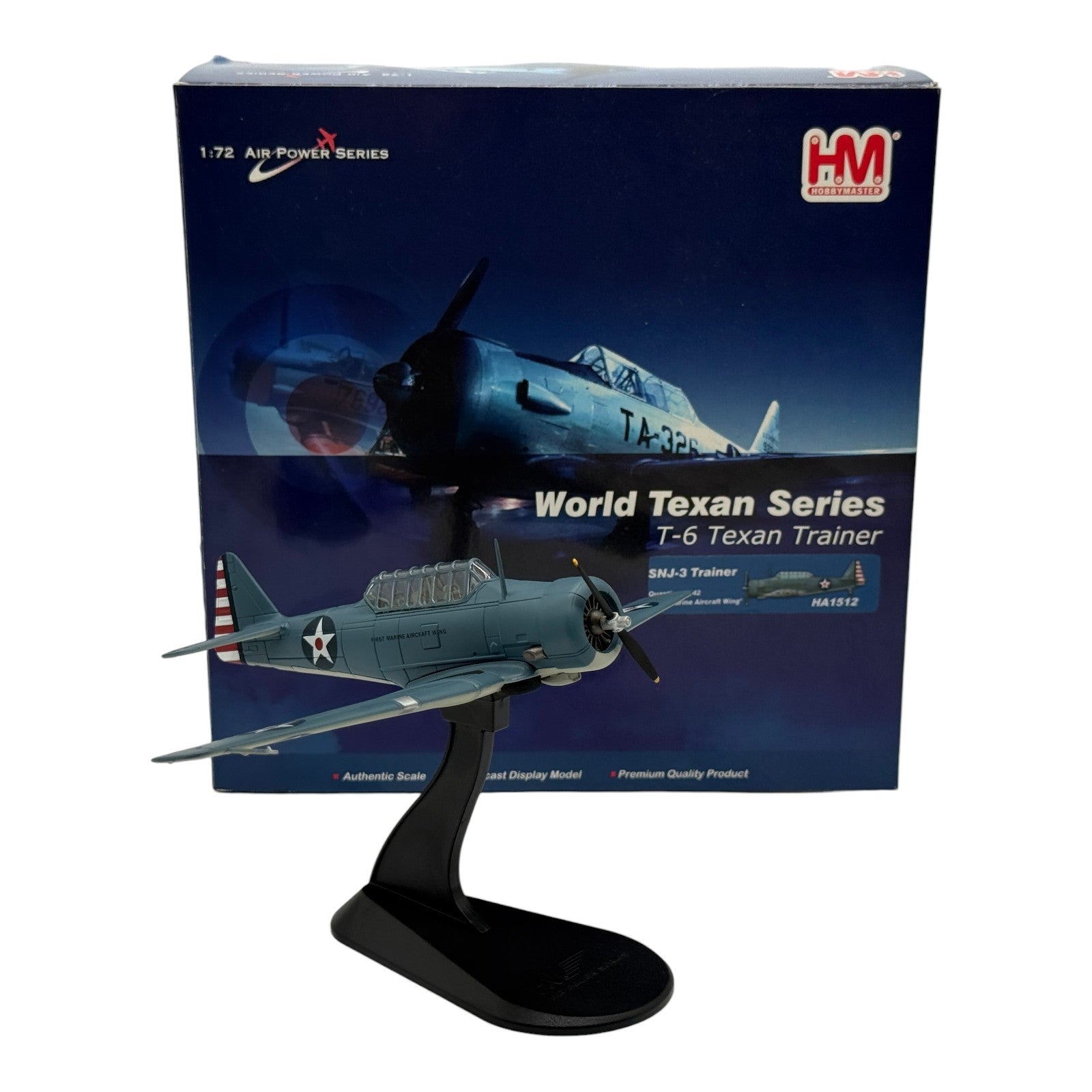 The Collectables Vault Hobby Master 1:72 scale diecast SNJ-3 Texan trainer model in blue-grey USMC livery on a stand.